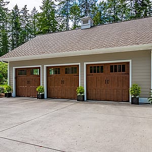 What is the difference between R-value and U-factor in garage doors?