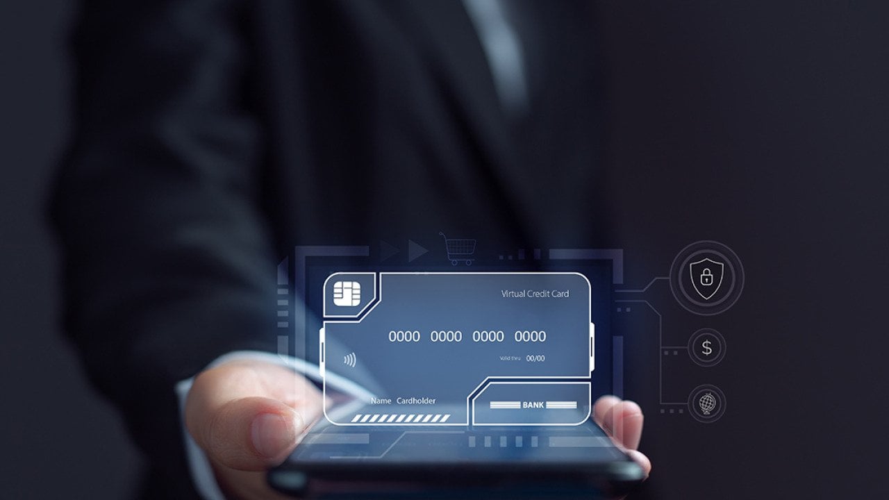 Businessman using an electronic credit card illustrated as a virtual screen.