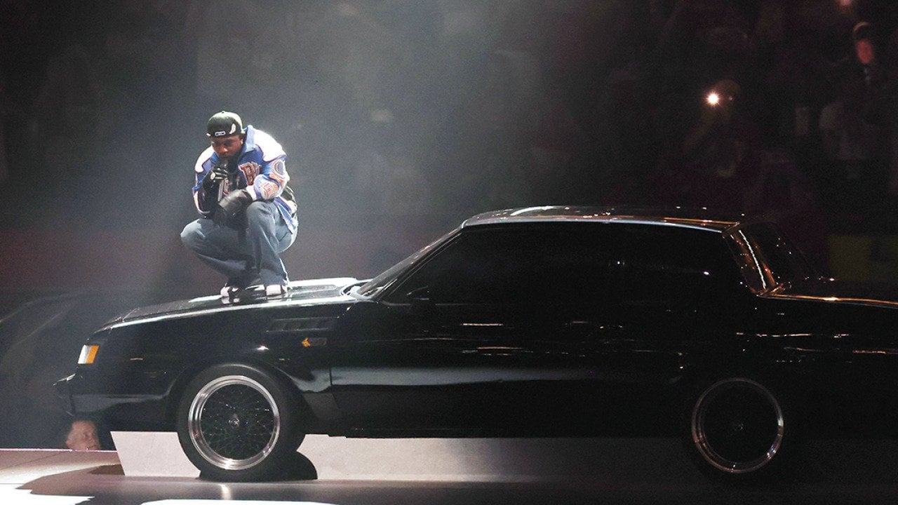Kendrick Lamar on top of a car during his Super Bowl LIX Halftime Show.