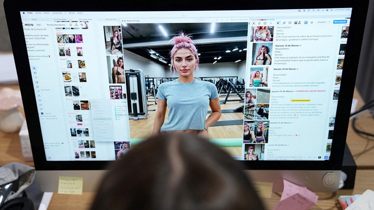  An employee works on the artificial intelligence-generated image of model Aitana Lopez at the headquarters of The Clueless company in Barcelona, on March 25, 2024.