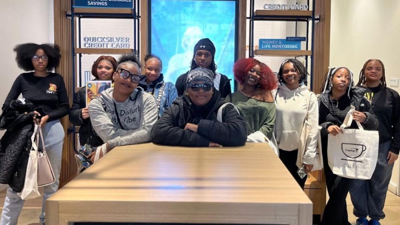 Group phot of mentors and mentees at H.D. Woodson’s Attendance Pep Squad who met with community partners to learn how to build a stronger school culture. 