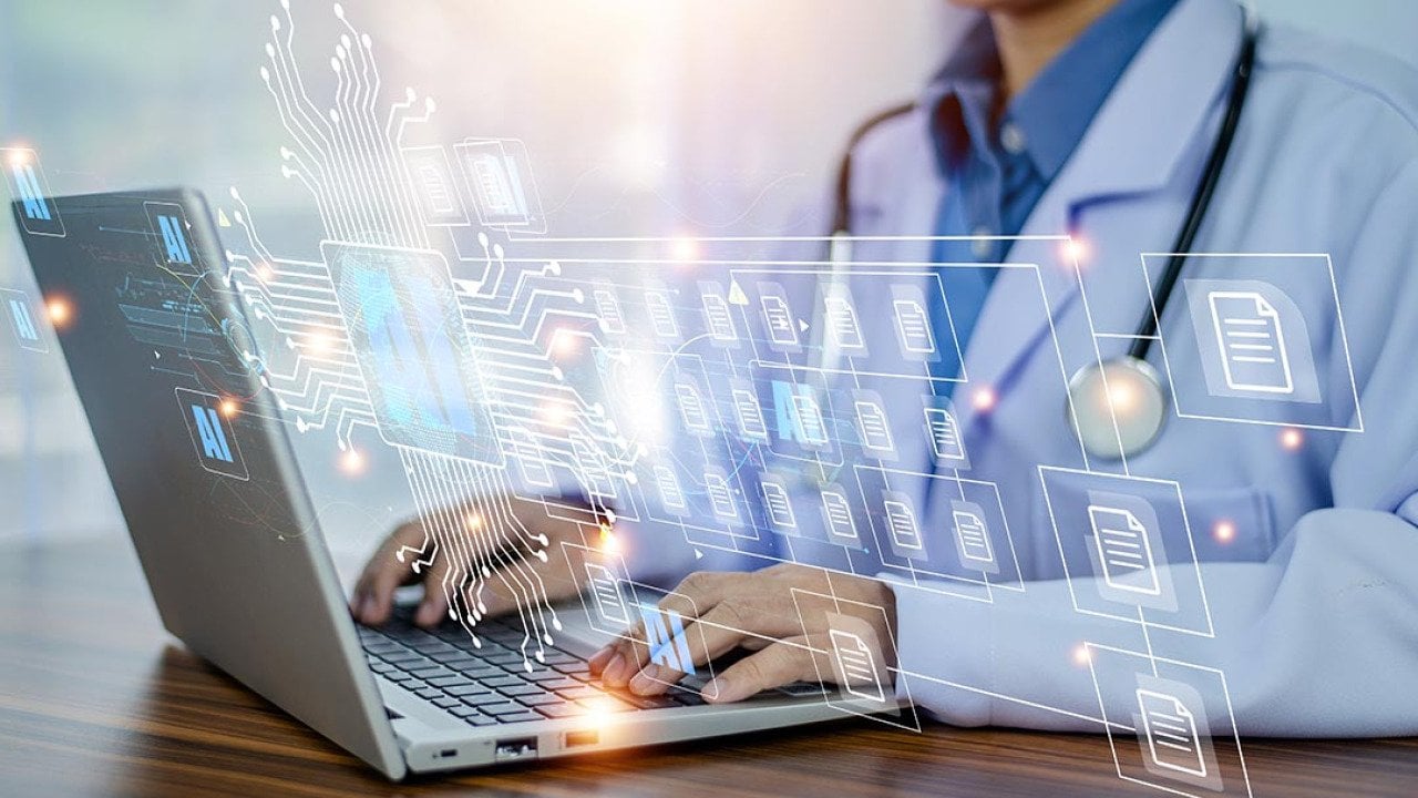 Concept of doctors using AI illustrated with medical professional with white coat and stethoscope using laptop computer with AI icons and symbols overlaid.
