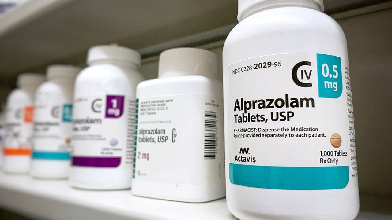 Bottles of Alprazolam bottle on a shelf.
