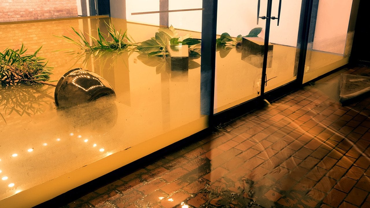 Water flowing from a flooded office during the tropical depression, Imelda, in Houston, Texas.