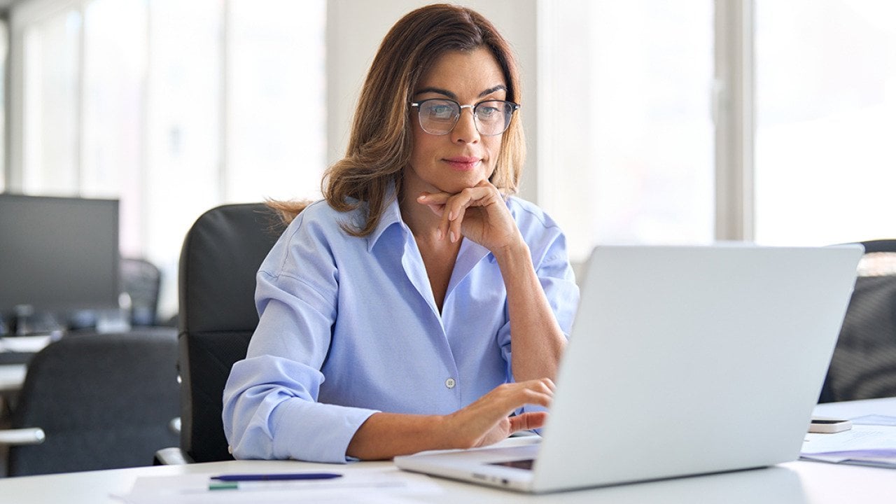 Middle-aged businesswoman in a corporate office.