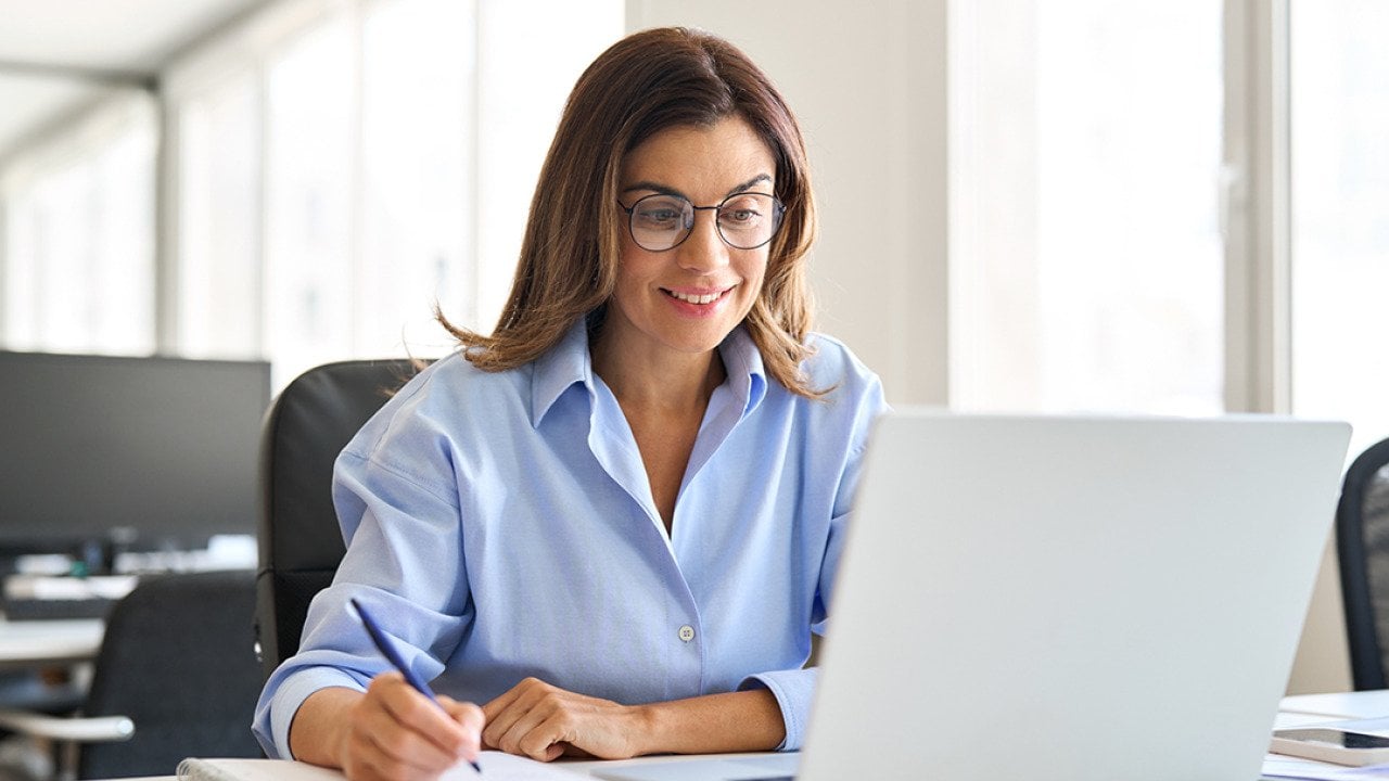 Middle-aged businesswoman working in a corporate office.