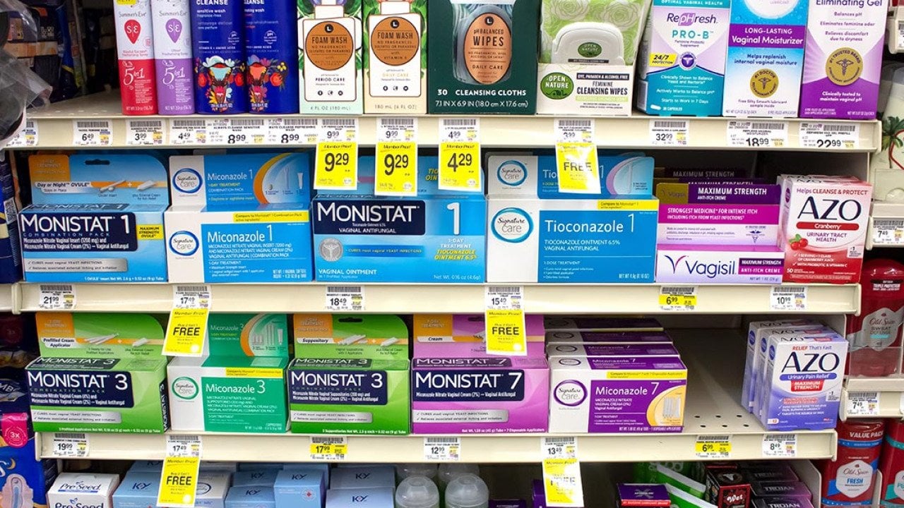 A view of several shelves dedicated to yeast infection products in a drugstore.