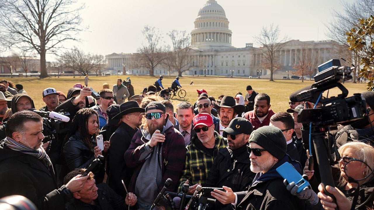 Members of the far-right group the Proud Boys, including their former leader Enrique Tarrio, Stewart Rhodes, Joe Biggs, Ethan Nordean and Zach Rehl speak to journalists on the east side of the U.S. Capitol, Feb. 2025.
