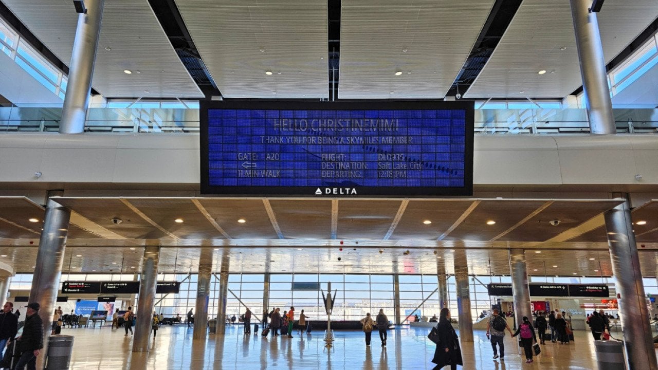 View of the Parallel Reality Experience, a personalized large screen monitor with flight information for Skymiles members at the Salt Lake City Airport.
