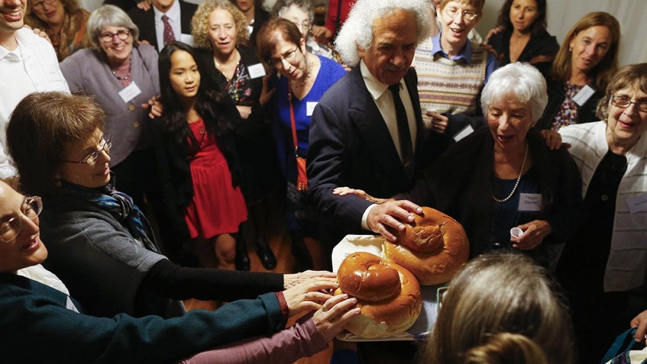 Congregation Eitz Chayim join together for the kiddush during their observance of Rosh Hashana in Cambridge, Massachusetts September 24, 2014. 