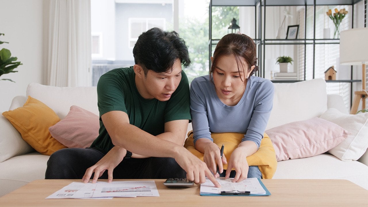 A young couple organizing expenses.