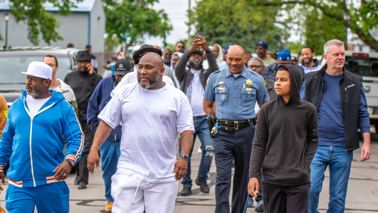  Roderick Parker, in white, Director of Big Hearts Community Projects at the 1,000 person march against gun violence in Fort Wayne, Indiana, on May 25th, 2025.
