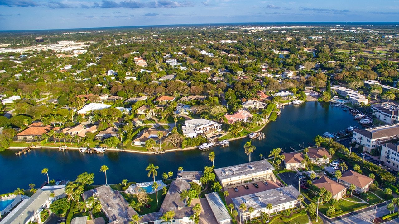 Aerial view of beachside residential homes in Naples, Florida.