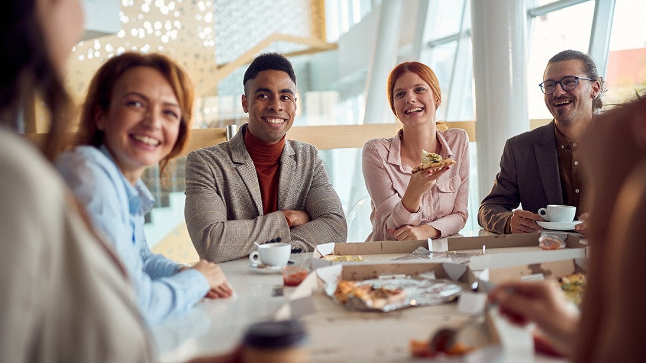A group of Gen Z employees during their lunch break at work.
