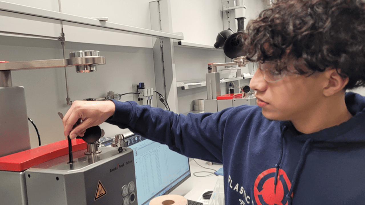Indianapolis student Danny Bonila works as a lab technician at Plastic Recycling Inc. 