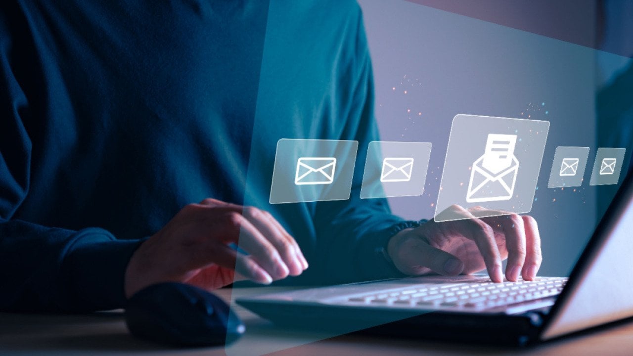 Businessman sending email to customer.