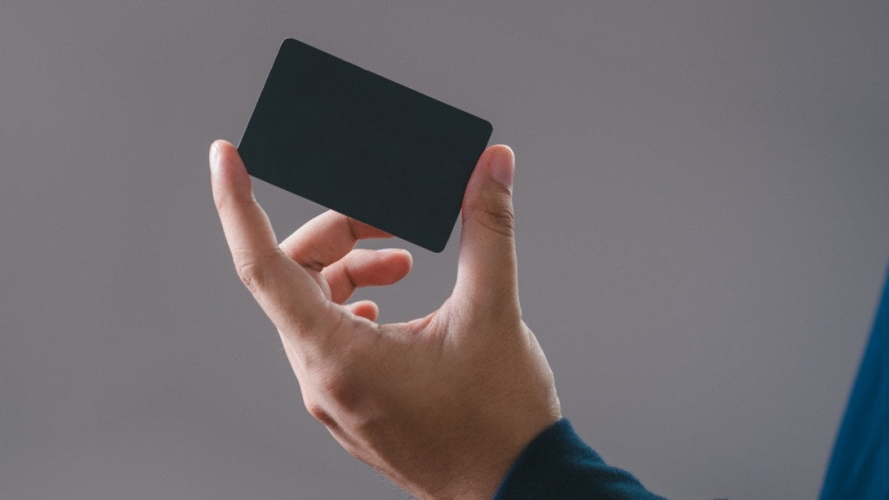 Hand holding a credit card.