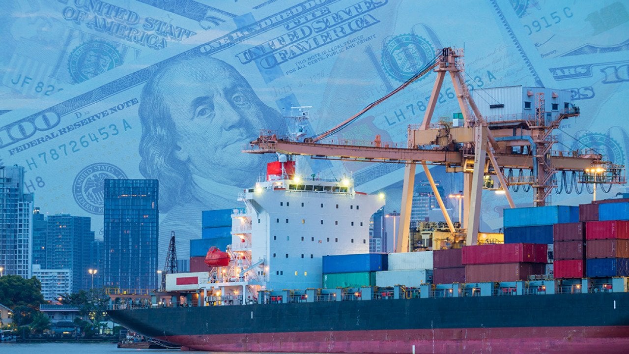A crane loading a cargo ship at a shipping port.