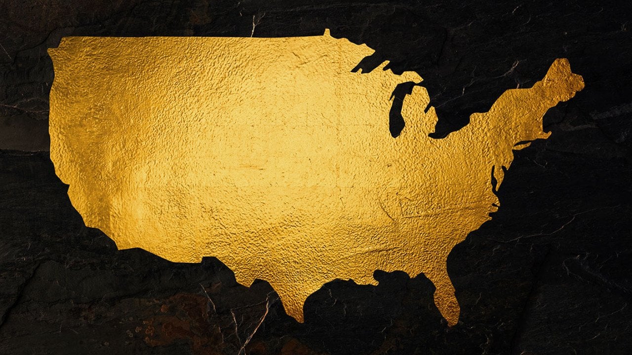 A map of the United States rendered in gold foil.