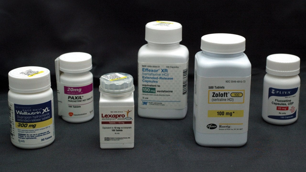 Bottles of antidepressant pills. From left to right: Wellbutrin, Paxil, Lexapro, Effexor, Zoloft, and Fluoxetine.