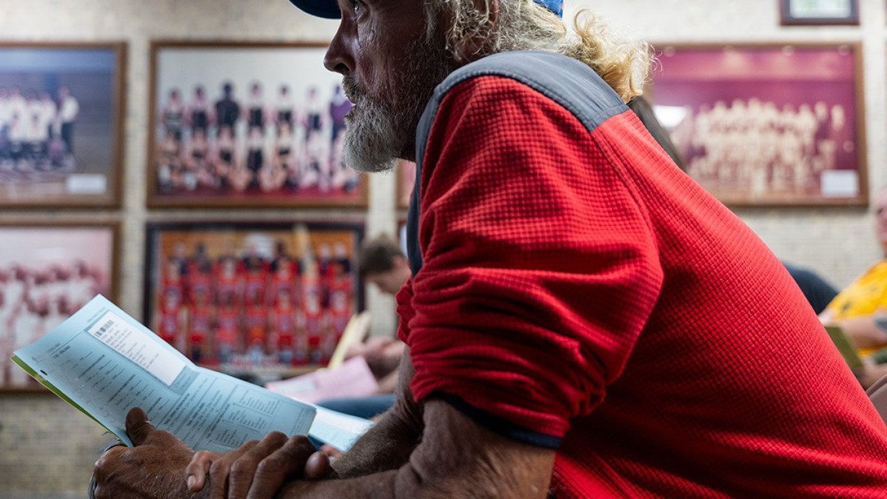 James Wolcott, a patient waits to take a vision test for a new pair of glasses at a Remote Area Medical (RAM) mobile dental and medical clinic at Terre Haute South High School, Indiana.