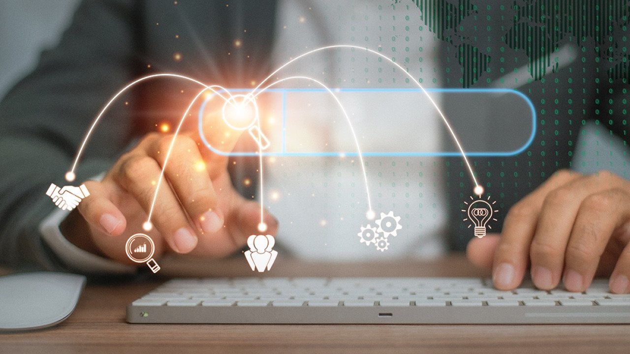 Person using a keyboard illustrated with data search technology graphics.