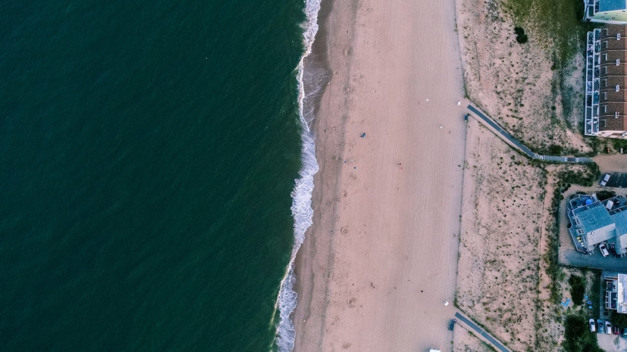 An aerial sunset view of Dewey Beach in Lewes, Delaware.