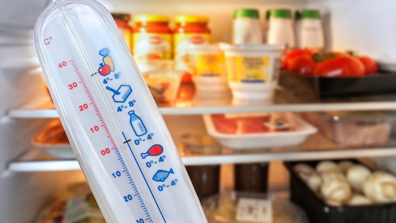 A temperature in front of an open refrigerator.