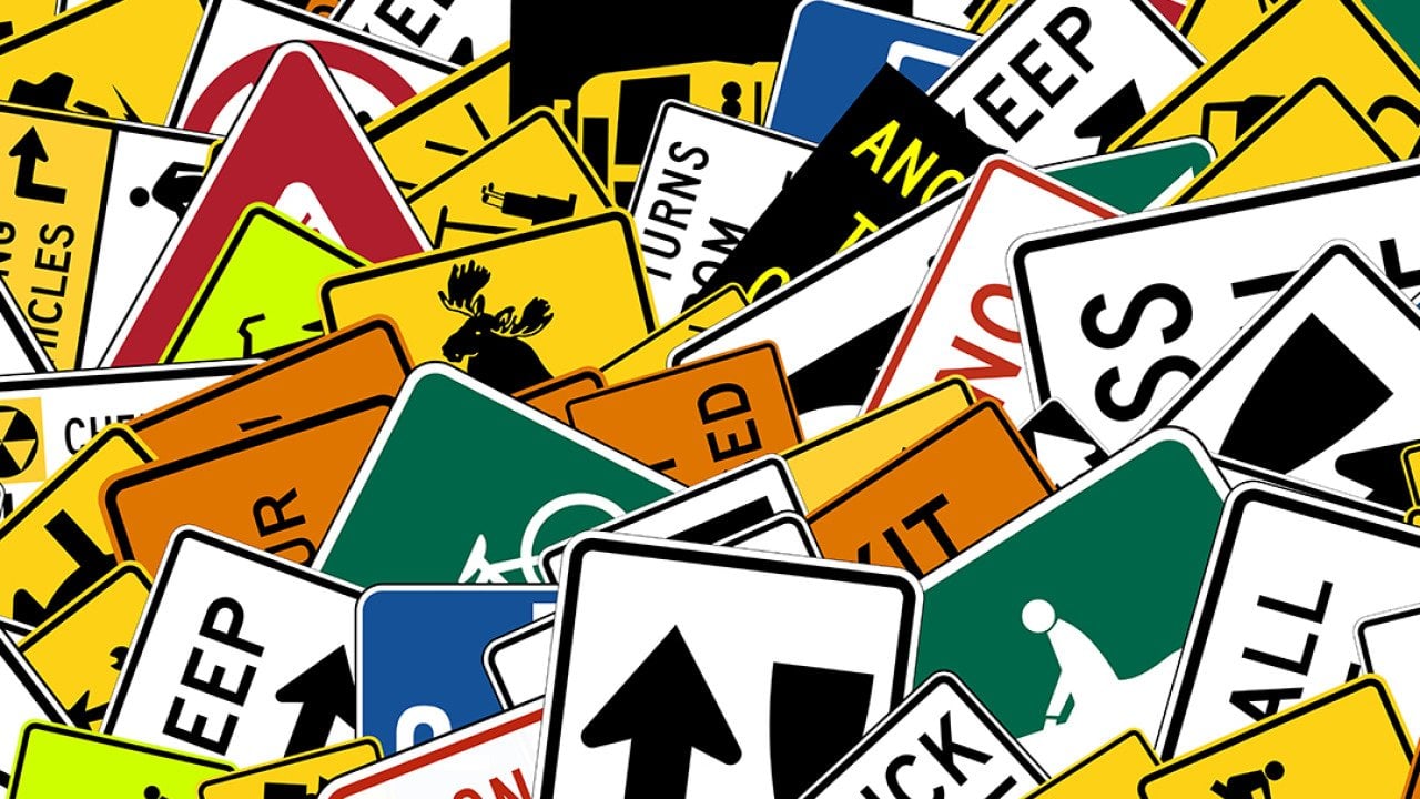 Collage of stacked road signs.
