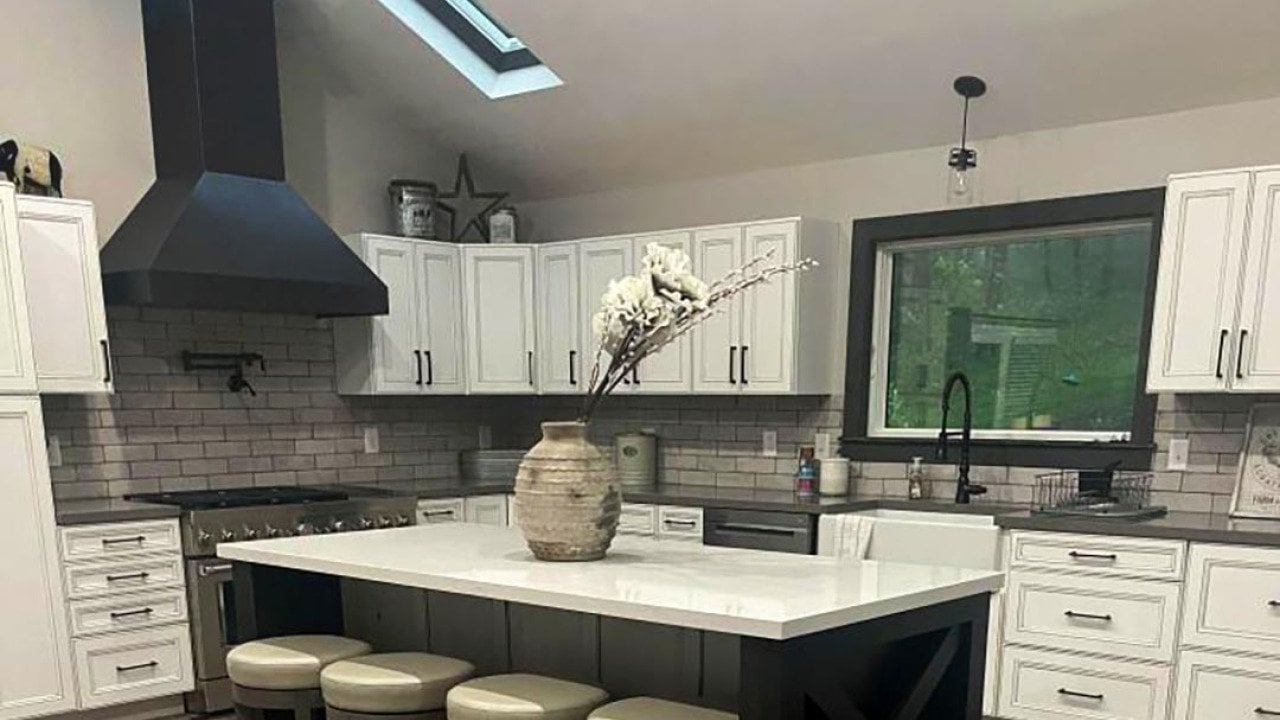 A modern kitchen with a sloped ceiling.