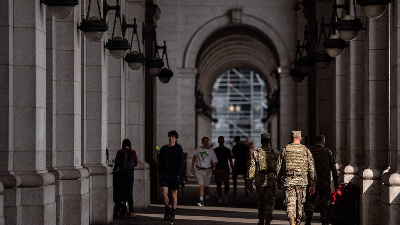 Members of the National Guard and members of Federal Law Enforcement Agencies stand outside the main hall of Union Station in Washington, D.C.