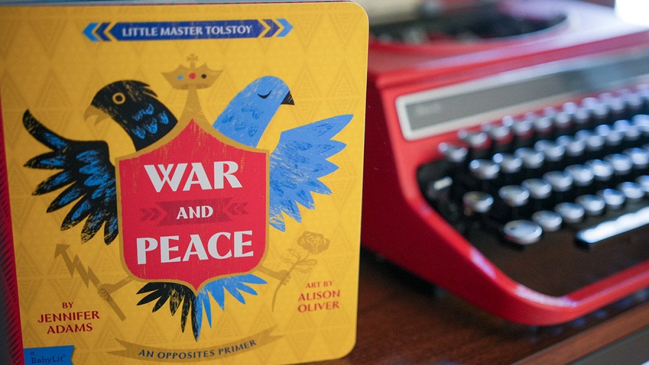 A version of Tolstoy's 'War and Peace' by Jennifer Adams as a children's book, beside a typewriter.