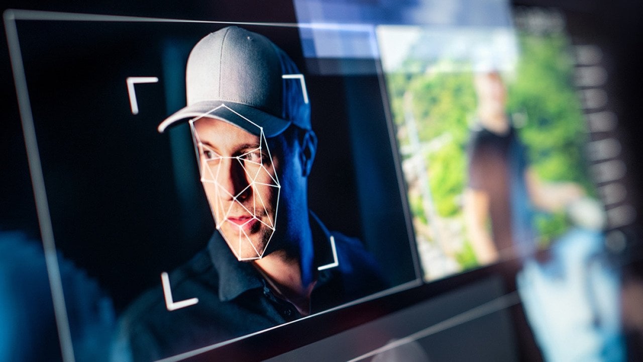 Picture of man's face on a computer screen.