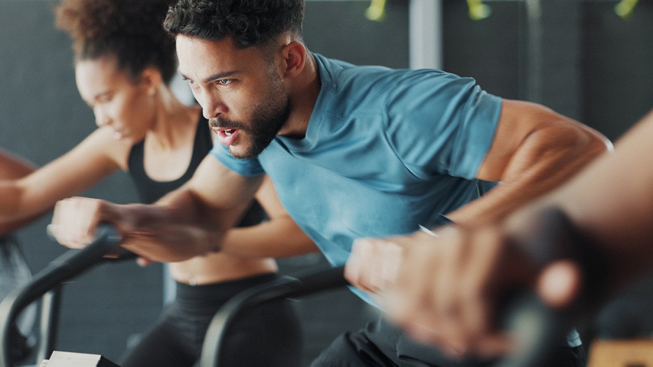 People during a fitness bike gym session.