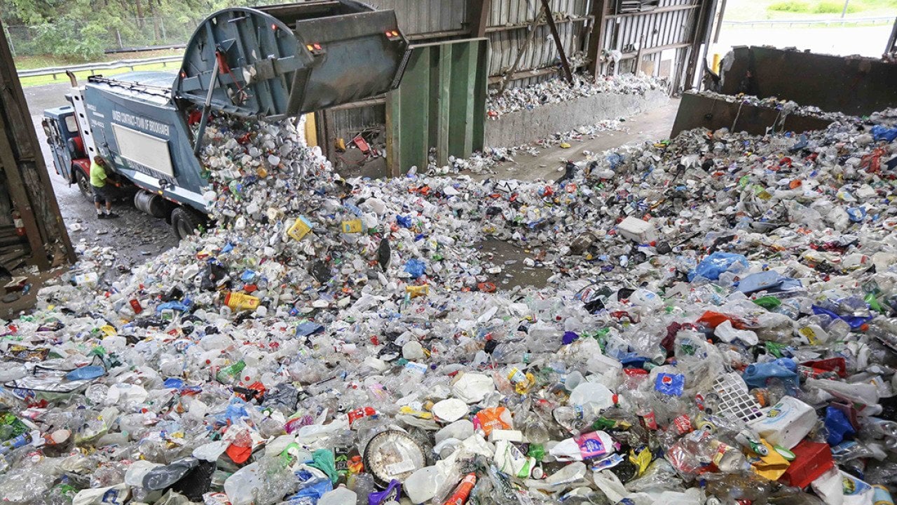A truck dumps recyclable items at the Brookhaven Material Recycling Facility in Yaphank, New York.