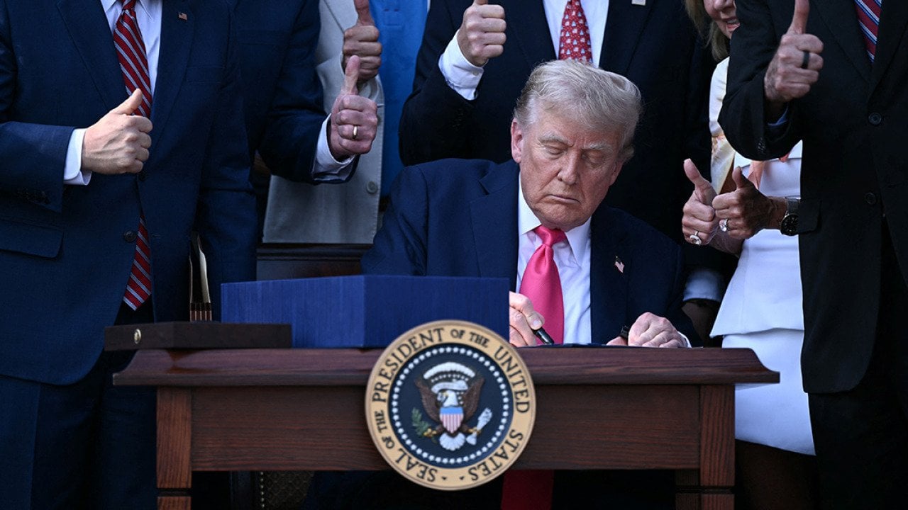 US President Donald Trump signs the 'Big Beautiful Bill Act' at the White House in Washington, DC on July 4, 2025. 