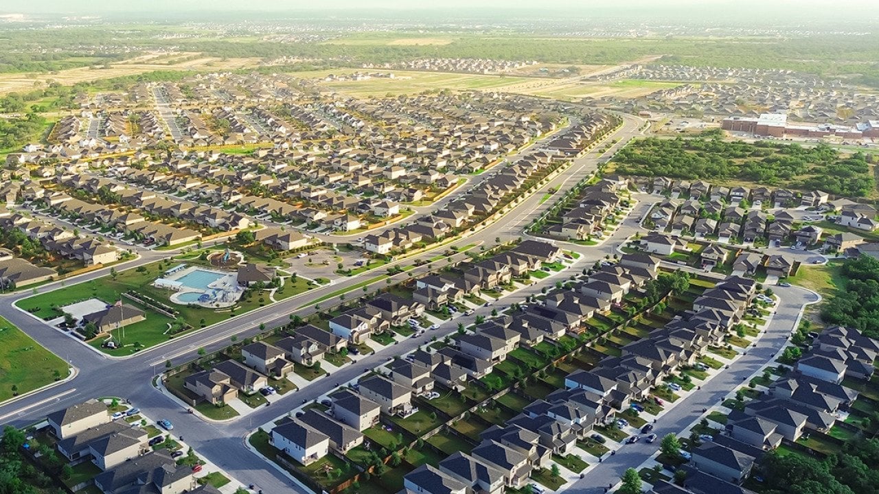 Aerial view of a masterplanned community of two-story houses in San Antonio, Texas.