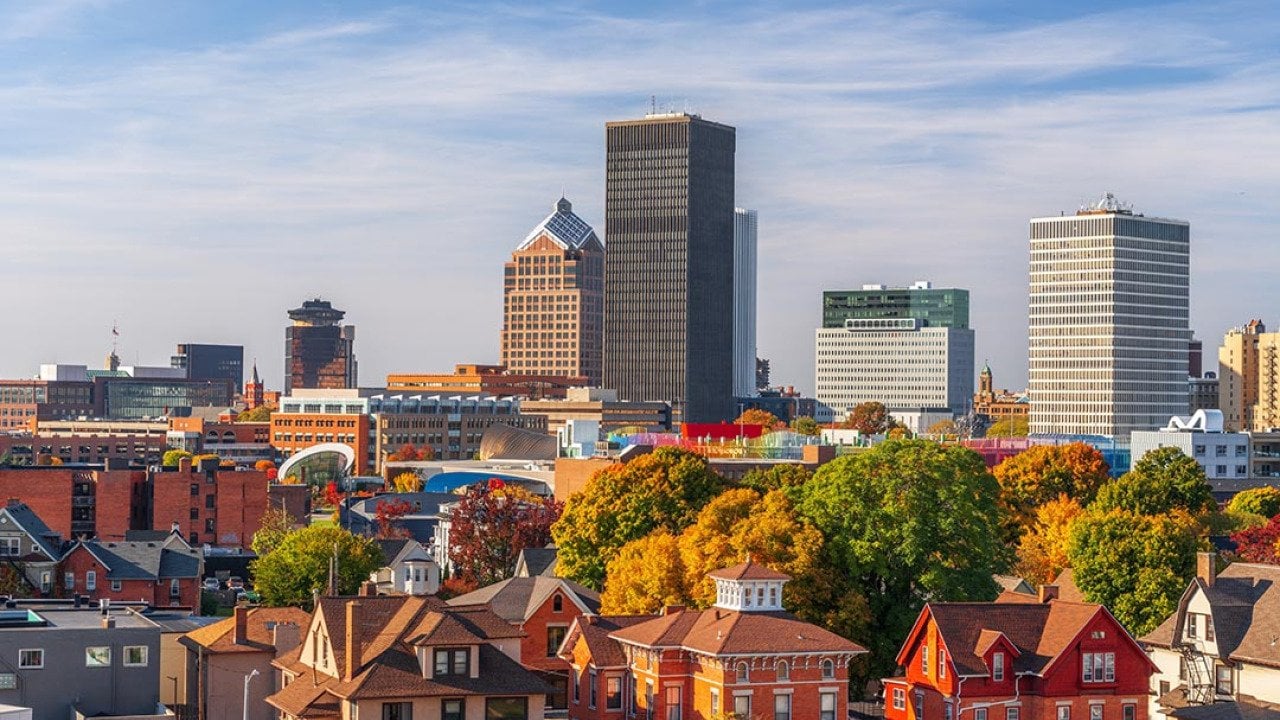 Rochester, New York, USA downtown city skyline colorful in early autumn season.