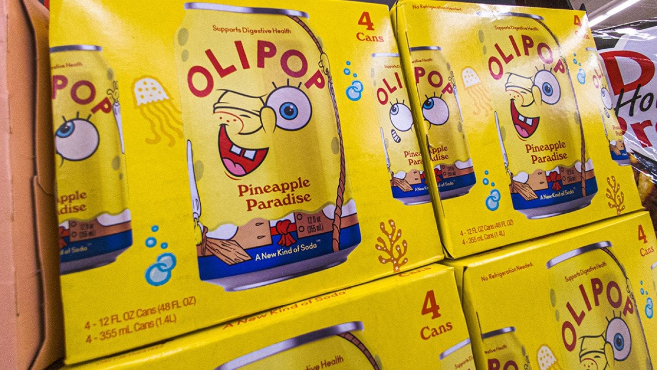 Boxes of OLIPOP's collaboration probiotic drink with Spongebob Squarepants 'Pineapple Paradise' on display on a grocery store.