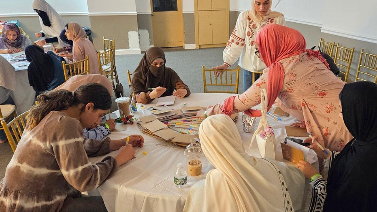 Women and girls of all ages gather for Sisters Self-Care Night at Muslim American Society Youth Center in Brooklyn, New York, a vibrant recurring event where creative activities and candid conversations help de-stigmatize seeking mental health support and weave faith and mental wellness together in community.