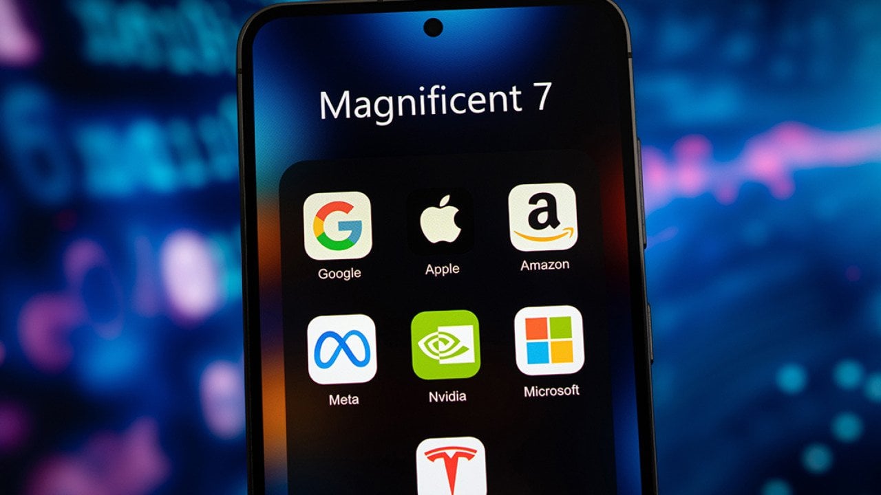 A smartphone's app folder named 'Magnificent 7' and displays app icons of Google, Apple, Amazon, Meta, Nvidia, Microsoft, and Tesla.