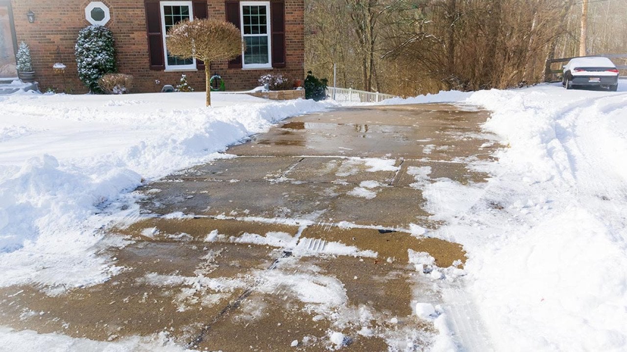 Long, steep, driveway in Kentucky after snow storm, all cleaned up with shoveling and salting. 
