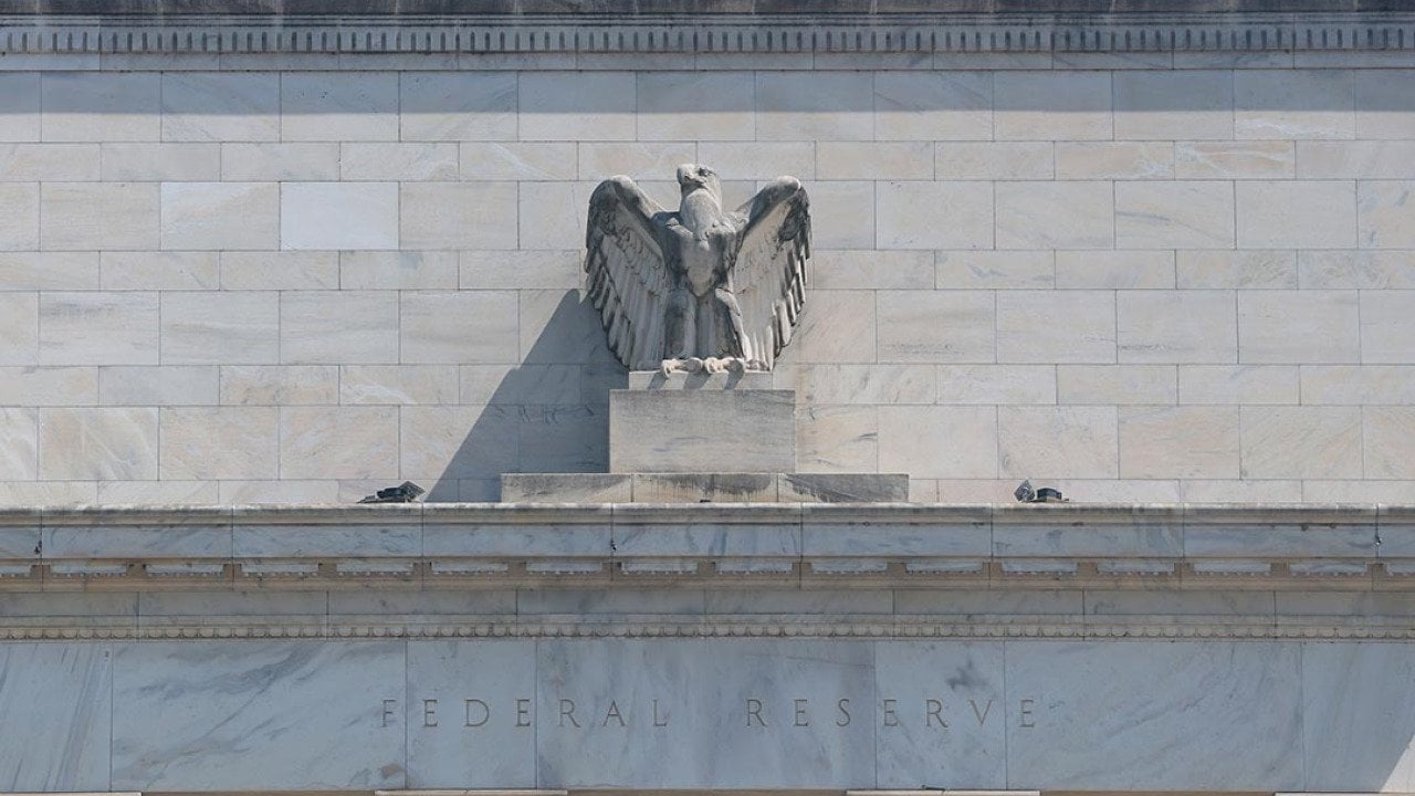 The Federal Reserve building with a figurine of the eagle above the doorway visible as it goes under construction on July 17, 2025 in Washington, DC.