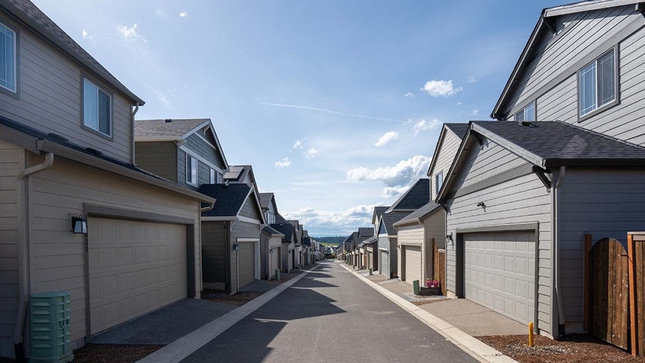 The driveway shared by single-family houses on smaller lots in a large suburban community.