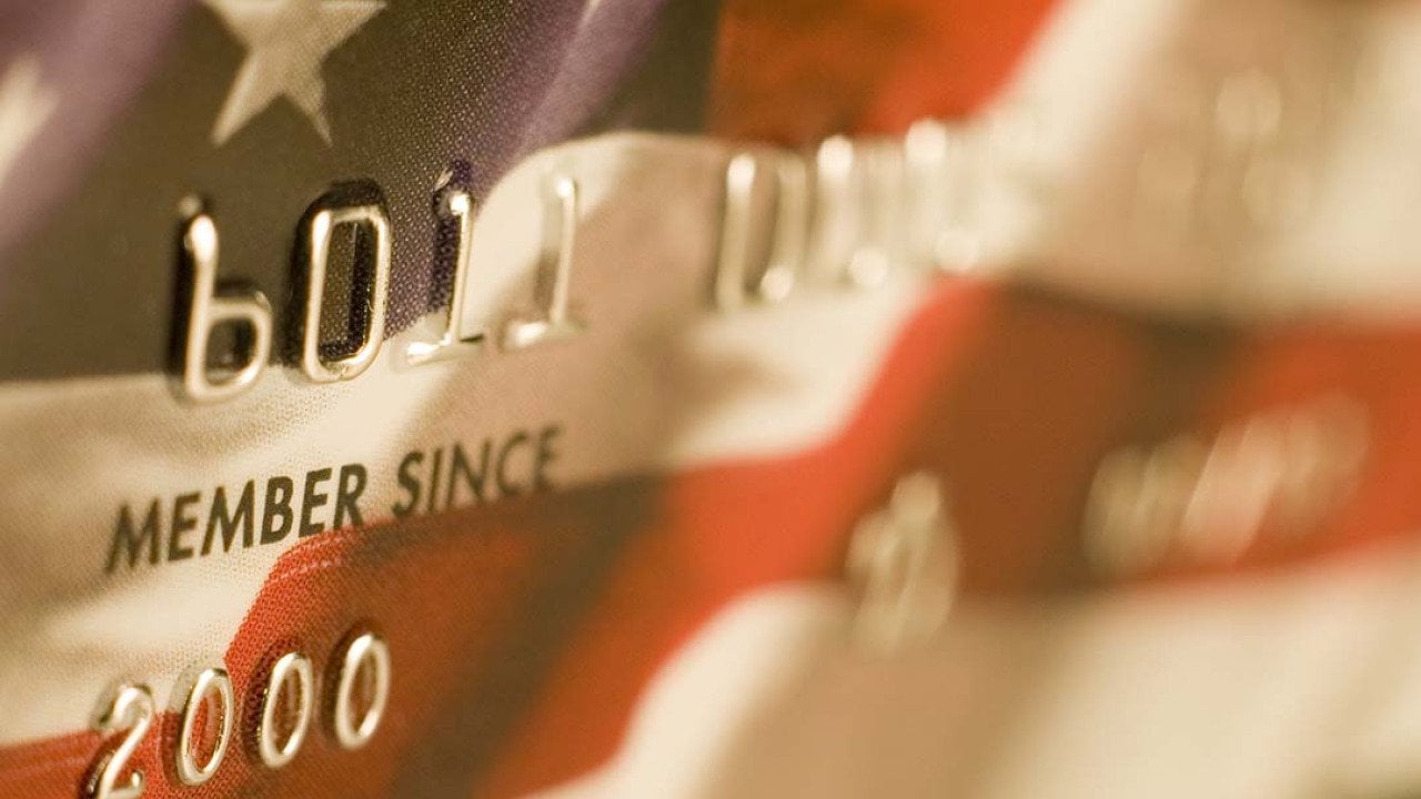 A close up of a credit card designed with the US flag.