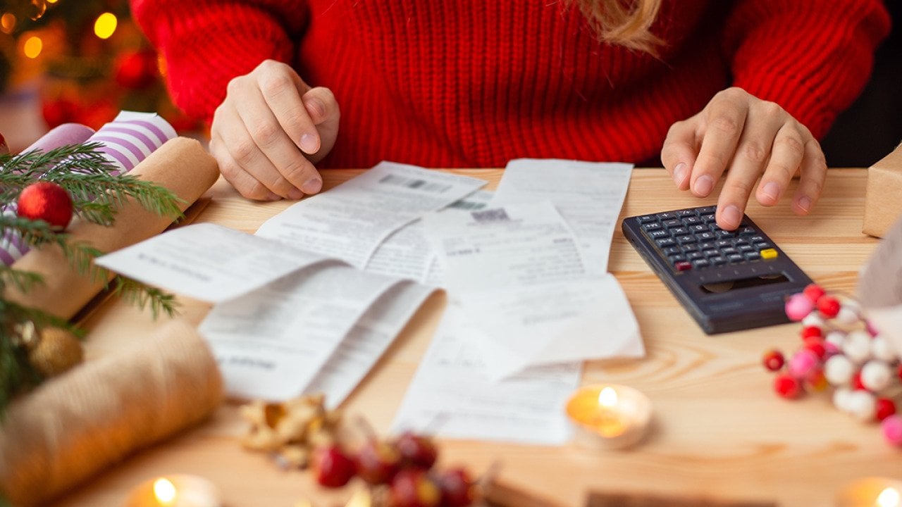 Person calculating expenses for the holidays.