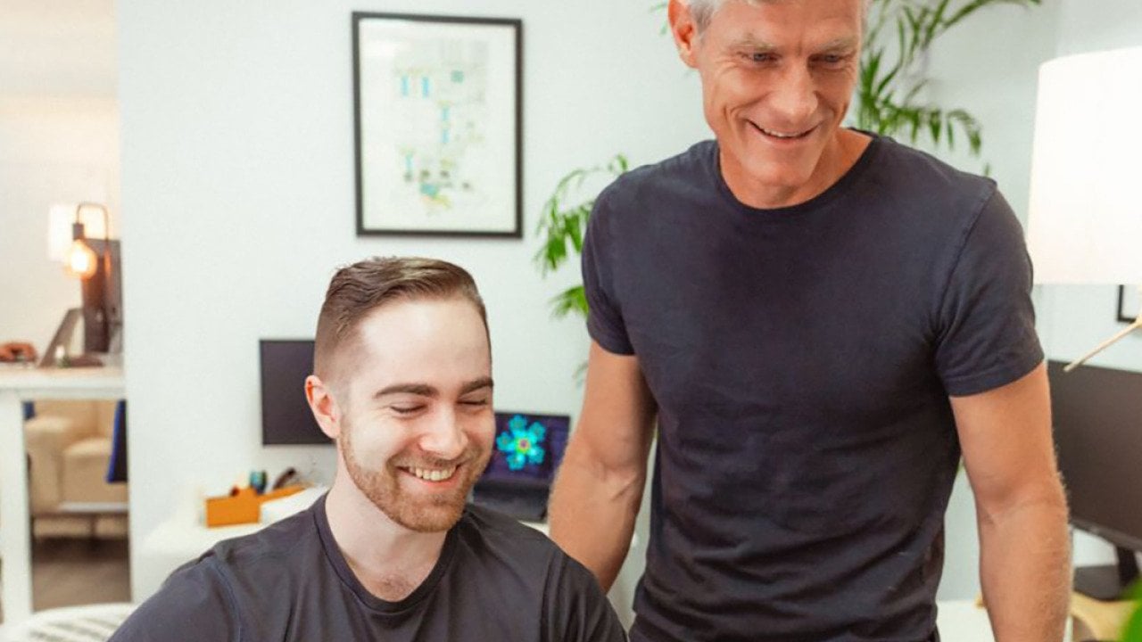 Startup professionals checking on a project in an office.