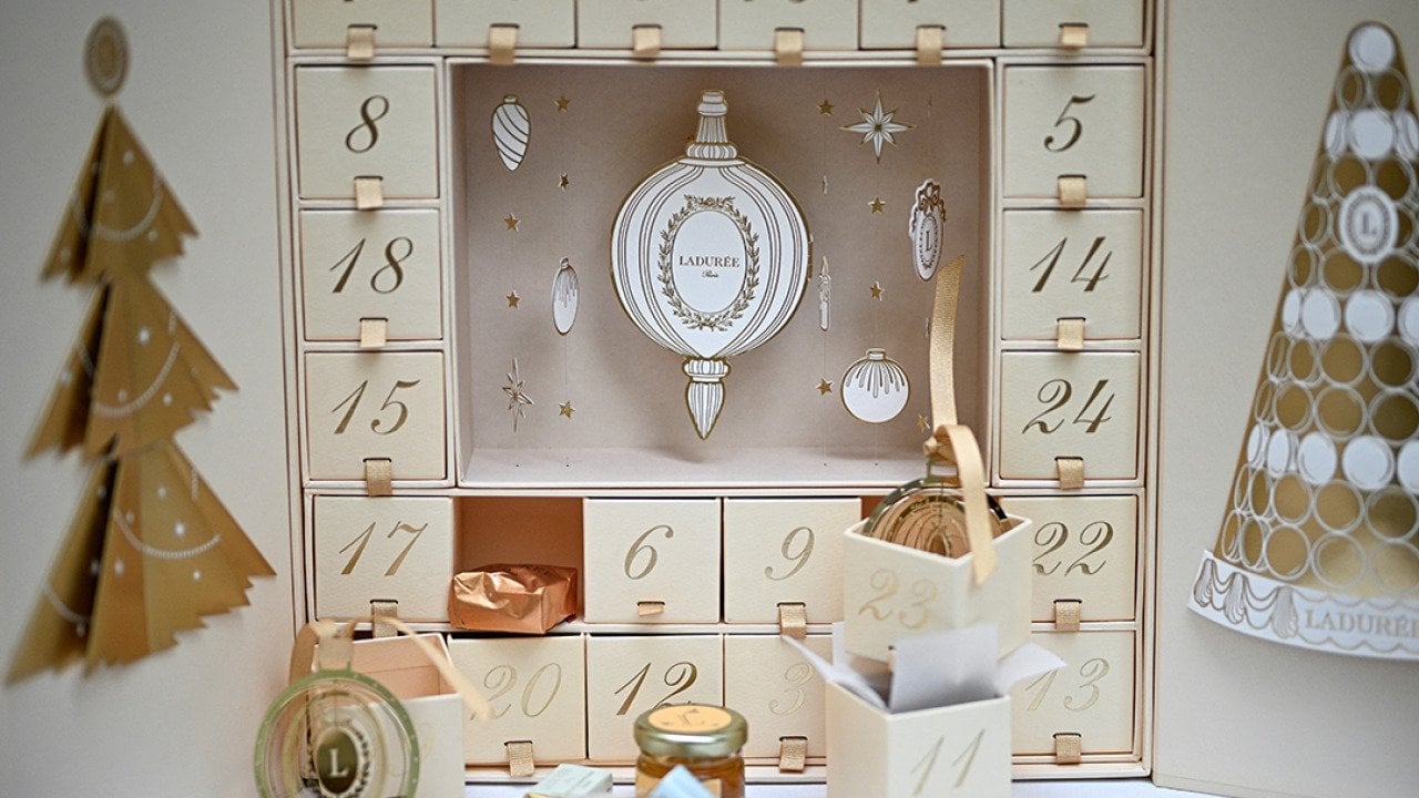 Ladurée gold Advent calendar displayed at their shop.