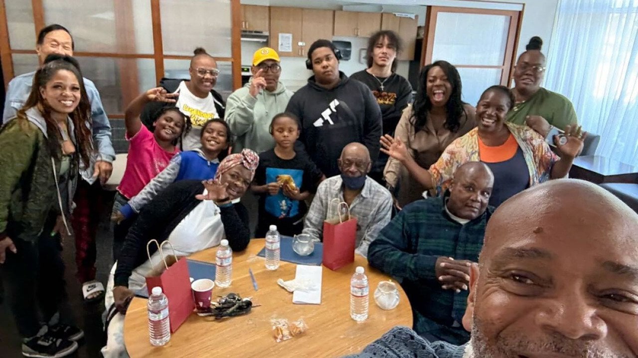  Dexter Hall, right, takes a self-portrait with formerly unhoused elders working with youth navigating homelessness.