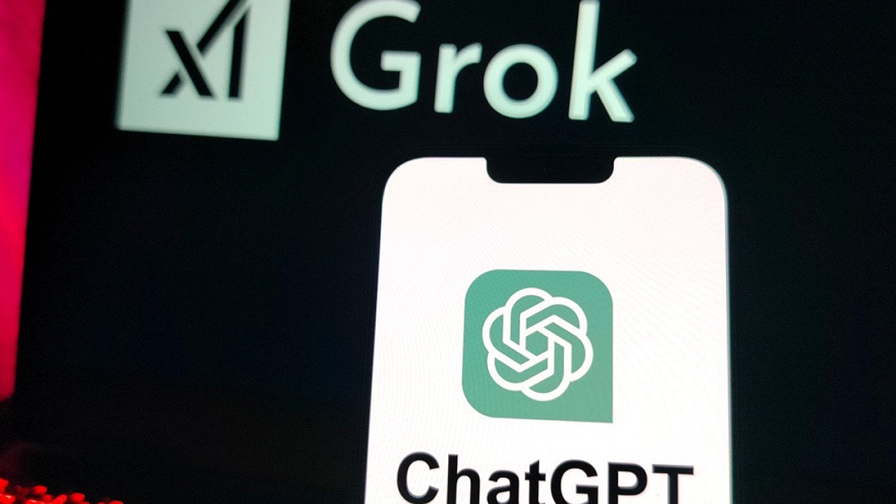 A smartphone displaying the ChatGPT logo and a laptop screen displaying X's Grok logo in the background.
